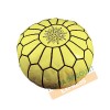 Yellow leather pouf with black arabesques