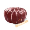 Dark red leather pouf with white arabesques