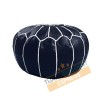 Midnight blue leather pouf with white arabesques