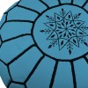 Sky blue leather pouf with black arabesques