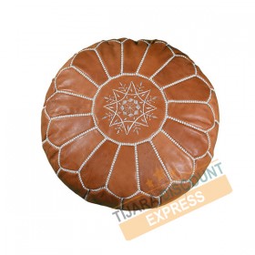 Light brown leather pouf with white arabesques